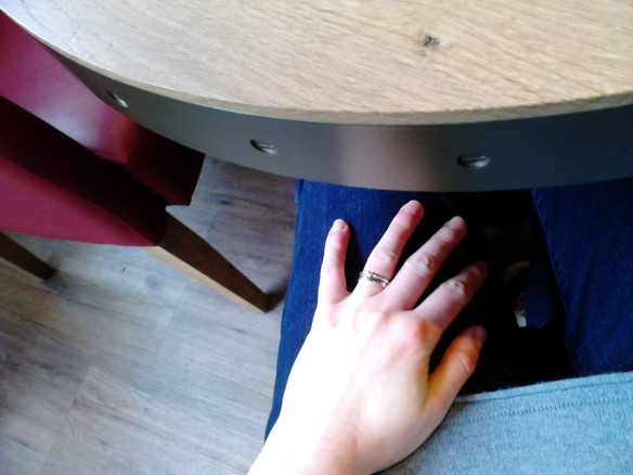 Admiring my rings under the table at the café, 1 March 2014
